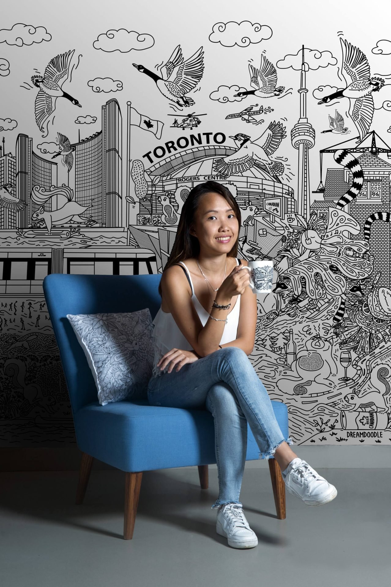 Celia Pang, Toronto-based doodle artist and graphic designer, working on an illustration.